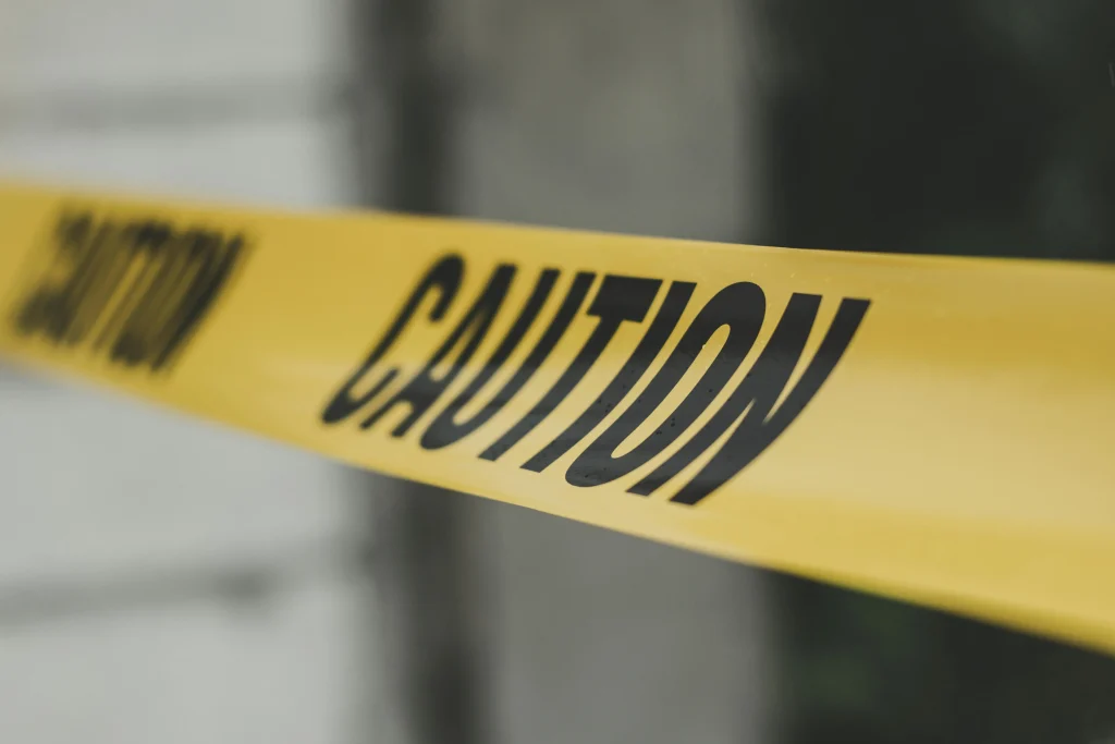 Yellow caution tape used as a symbol for health and safety warnings